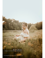 woman sitting in a wildflower field at dusk portrait photography