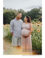 pregnant couple embracing in a sunflower field maternity photography