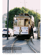 vintage yellow tram on a cobblestone street cityscape photography