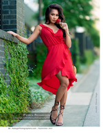 woman in a red dress holding a rose fashion photography