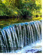 small waterfall cascading over mossy rocks landscape photography