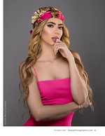 woman in a pink top and printed headscarf studio portrait photography
