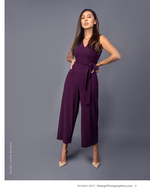 woman in a plum jumpsuit studio fashion photography