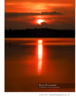 sun setting over a lake with a mirrored light trail landscape photography