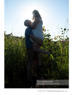 couple silhouetted against the sun in a wildflower field portrait photography