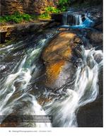 water cascading over layered rocks landscape photography