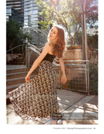 woman twirling her skirt on urban stairs fashion photography