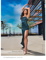 woman in a teal satin dress on a rooftop terrace fashion photography
