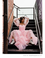 woman in a pink tulle gown and white boots on a fire escape fashion photography