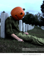 surreal pumpkin-headed figure seated among cemetery headstones portrait photography