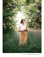 woman standing on a sunlit forest path portrait photography