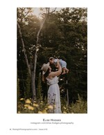 mother lifting baby into the air among the trees family photography