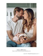 parents nose to nose holding their newborn baby family photography