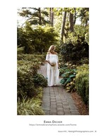 pregnant woman in a lace gown walking a garden path maternity photography