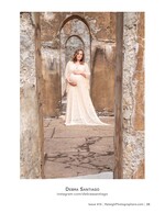 pregnant woman in flowing gown framed by stone archways maternity photography