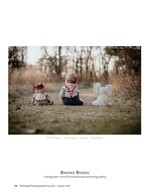 baby seated between two stuffed animals infant photography