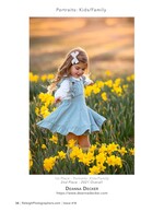 girl in blue dress twirling through daffodils family photography