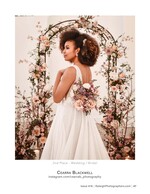 bride beneath a floral wedding arch wedding photography