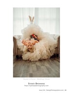 bride reclining on a sofa in a tulle gown wedding photography