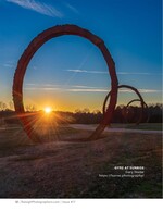 large rusted ring sculpture silhouetted at sunrise fine art landscape photography
