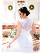 bride's lace-covered back beneath white porch columns bridal portrait photography