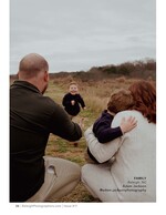 toddler running toward his father in an open field family portrait photography