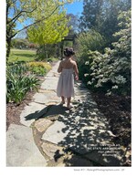 little girl walking a stone garden path children's portrait photography