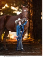 young cowgirl in a hat holding her horse's lead children's portrait photography