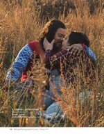couple embracing in tall golden grass couples portrait photography