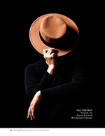 wide-brim hat obscuring a photographer's face self-portrait photography