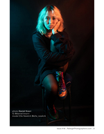 model lit in teal and red tones portrait photography