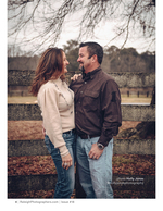 couple laughing beside a wooden fence portrait photography