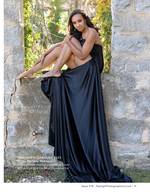 woman in a black gown at a stone ruin portrait photography