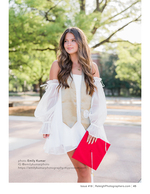 graduate holding her cap on a college walkway senior portrait photography