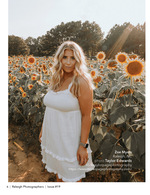 woman standing in a sunflower field senior portrait photography