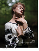 woman in an embroidered blouse in soft forest light fashion photography