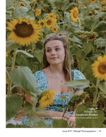 young woman seated in a sunflower field senior portrait photography