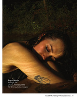 woman resting in shallow creek water at night artistic portrait photography