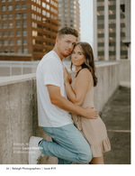 couple embracing on a rooftop above the skyline couples portrait photography