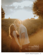 couple kissing in a sunlit field engagement photography