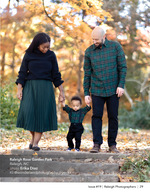 family walking hand in hand through fall leaves family photography